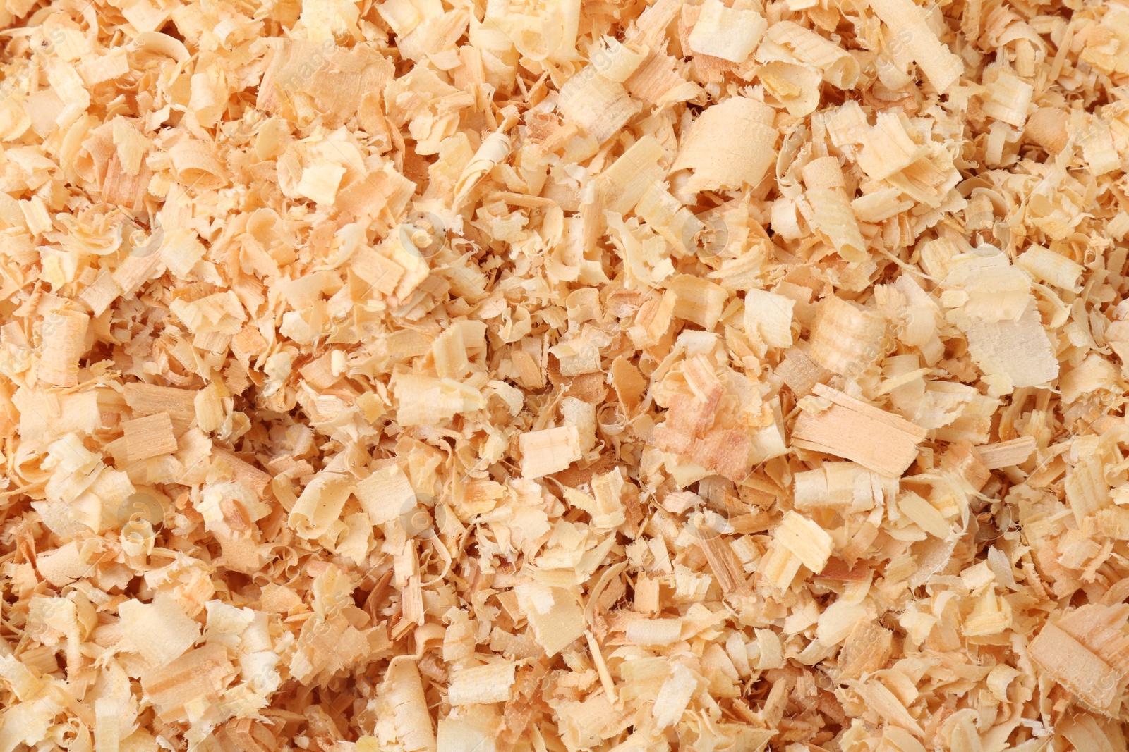 Photo of Pile of natural sawdust as background, top view