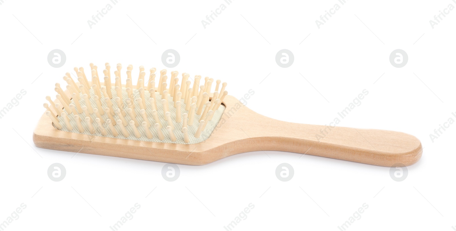 Photo of New wooden hair brush isolated on white