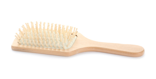 New wooden hair brush isolated on white