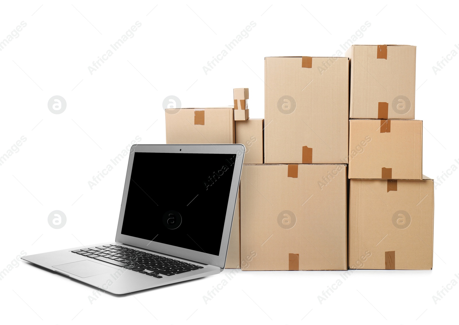 Image of Online selling. Laptop and parcels on white background