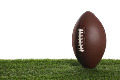 Photo of Leather American football ball on lawn against white background