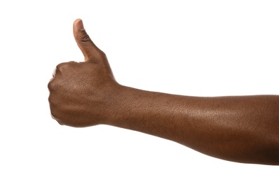 African-American man showing thumb up gesture on white background, closeup