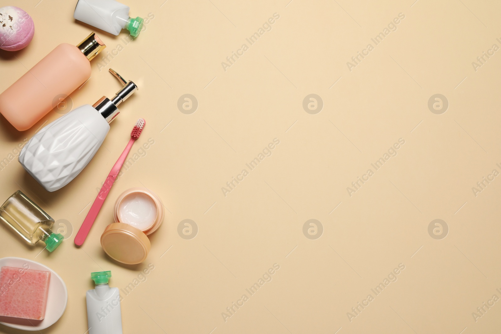 Photo of Bath accessories. Flat lay composition with personal care products on beige background, space for text