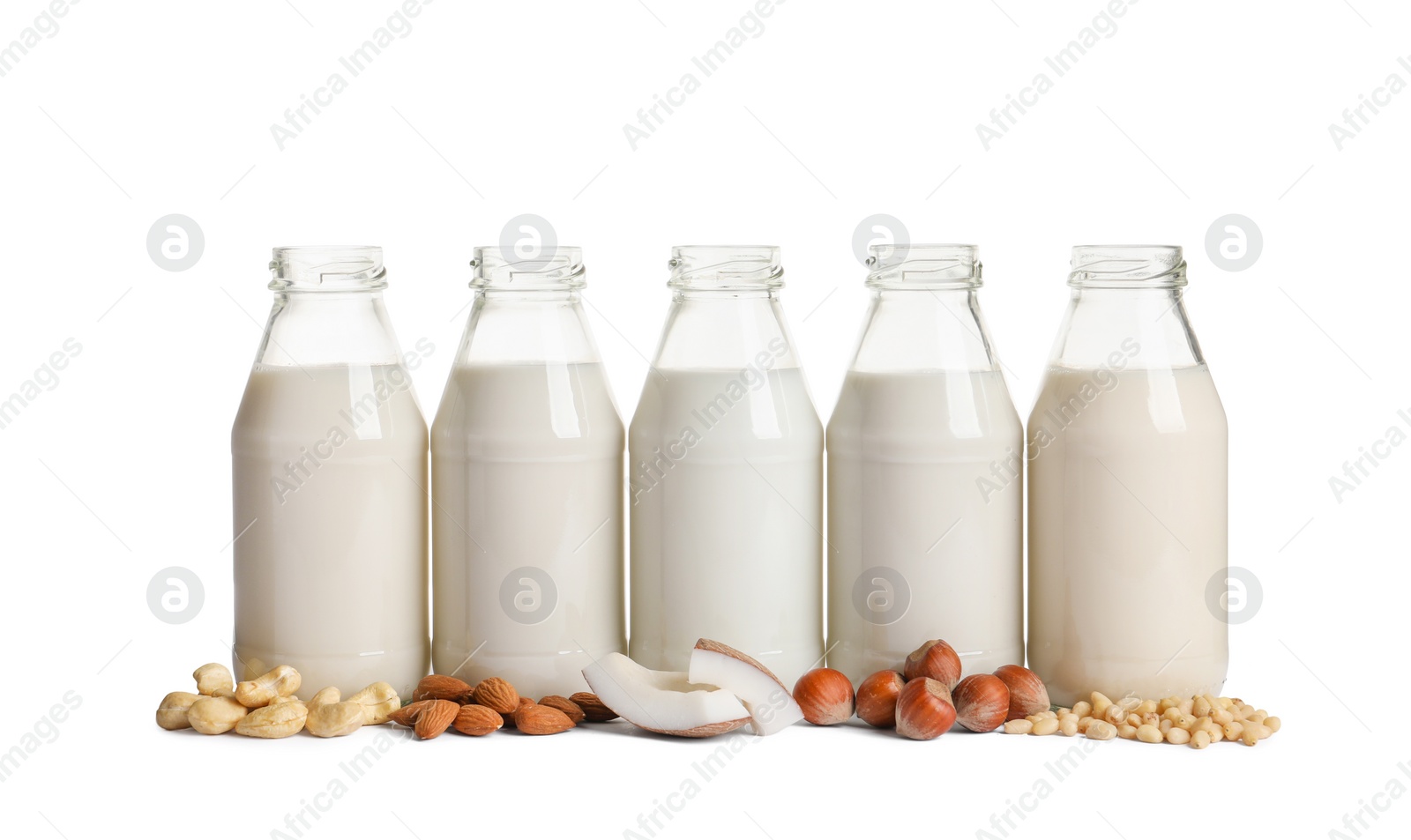 Photo of Vegan milk and different nuts on white background