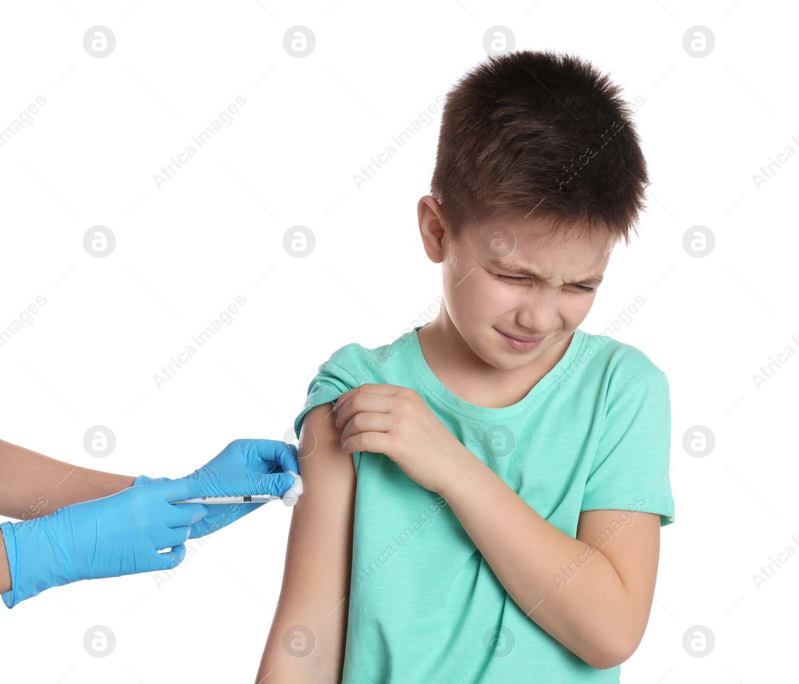 Photo of Doctor vaccinating little child on white background