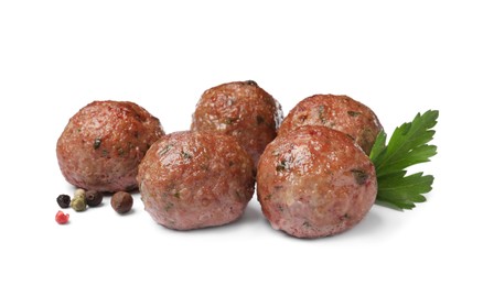 Photo of Many tasty cooked meatballs with parsley on white background