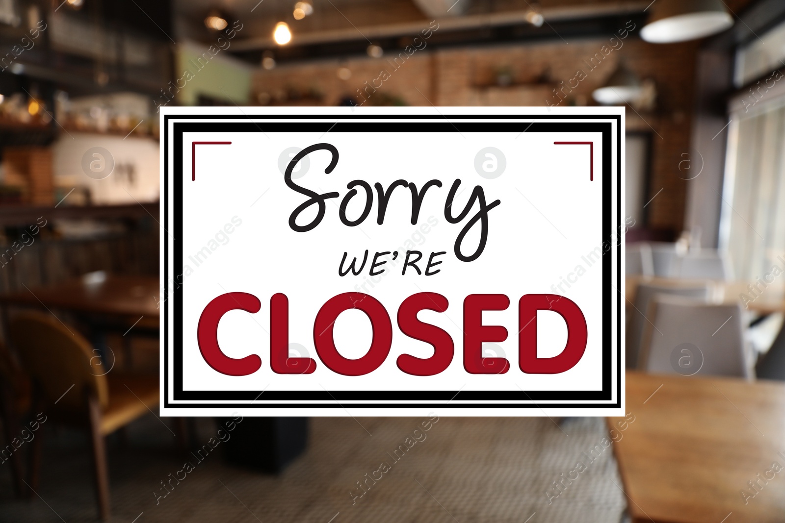 Image of Sorry we are closed sign against blurred background