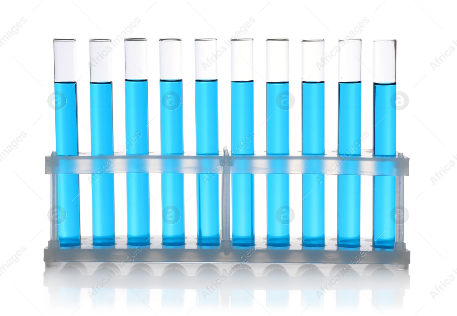 Photo of Test tubes with blue samples on white background