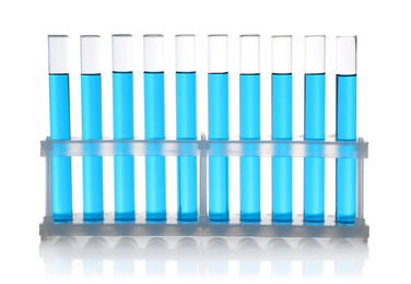 Photo of Test tubes with blue samples on white background
