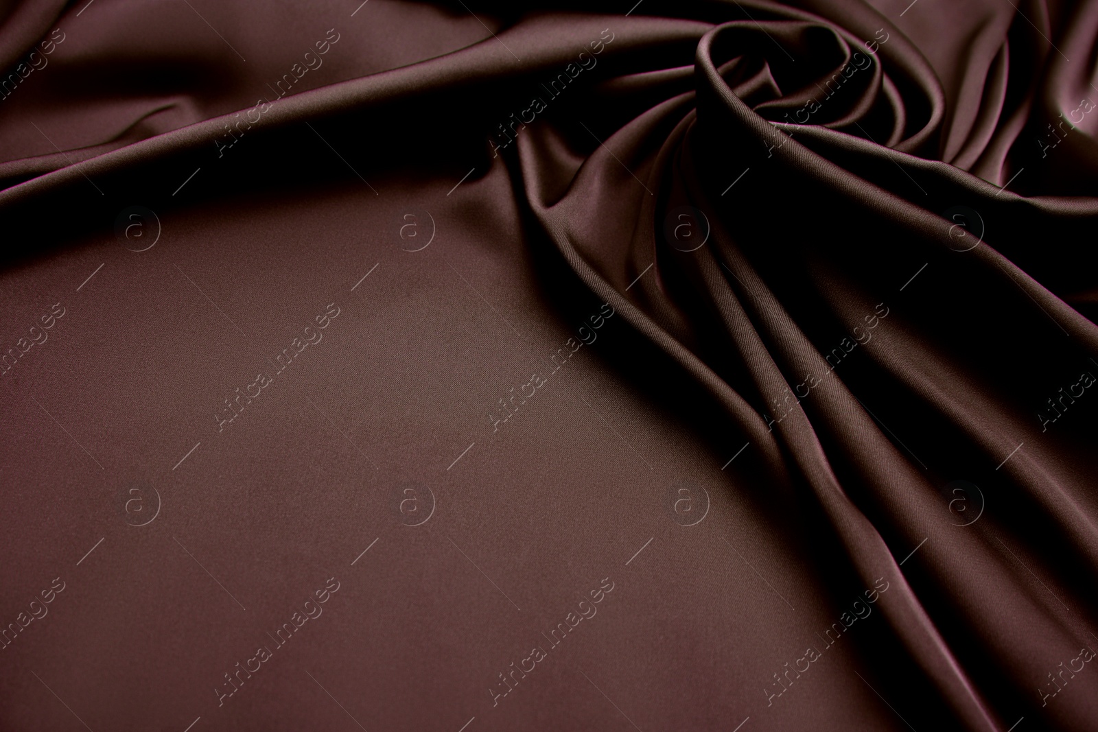 Image of Delicate brown silk fabric as background, closeup view
