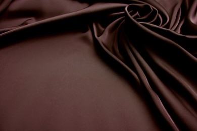 Delicate brown silk fabric as background, closeup view