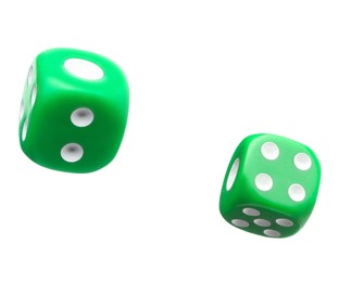 Image of Two green dice in air on white background