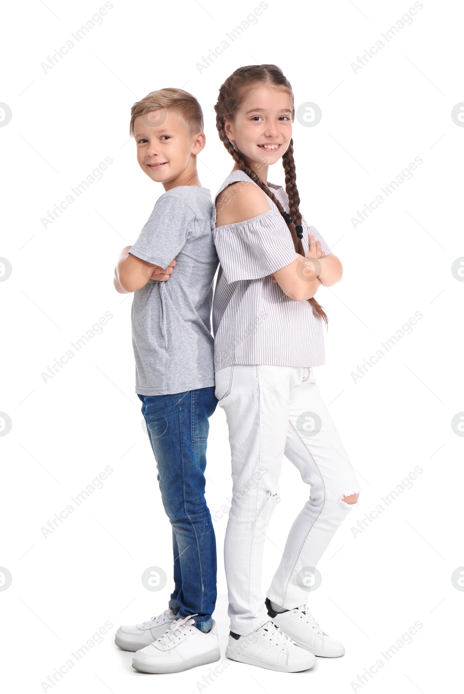 Photo of Cute little children on white background. Happy family