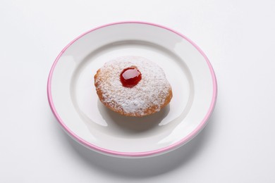 Hanukkah donut with jelly and powdered sugar on white background