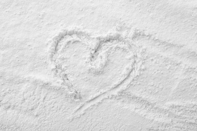 Heart drawn on baking powder, top view