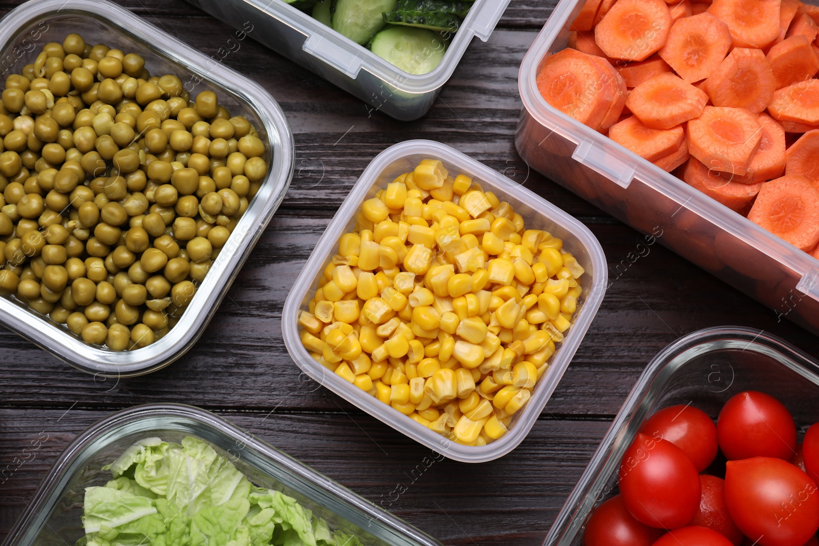 Photo of Glass and plastic containers with different fresh products on wooden table, flat lay