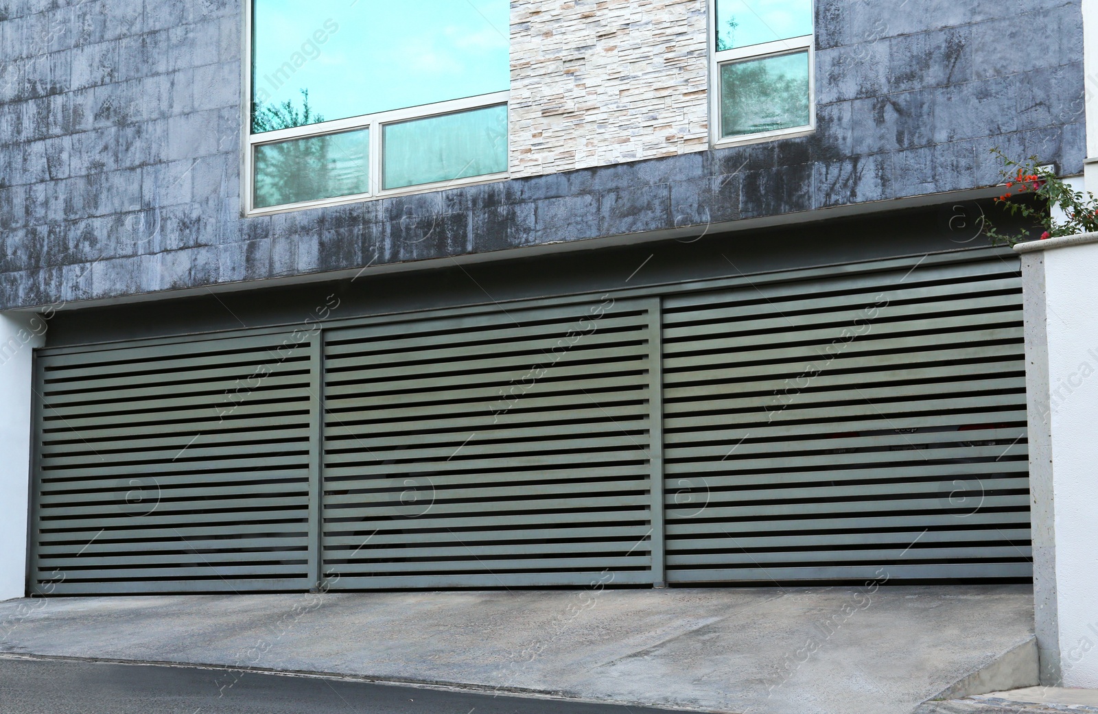 Photo of Closed roller shutter gates of modern garage