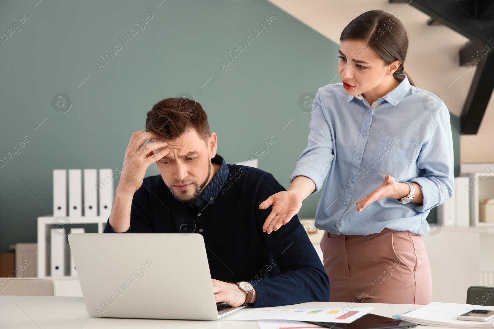 Photo of Office employees having argument at workplace