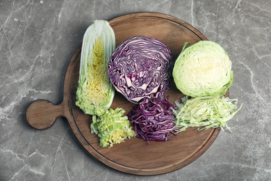 Flat lay composition with different cabbages on table