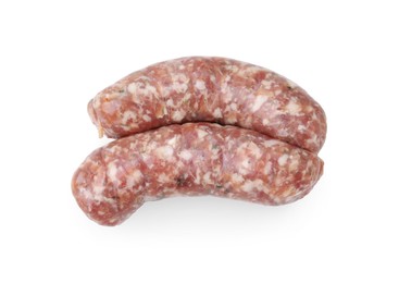 Photo of Two raw homemade sausages isolated on white, top view
