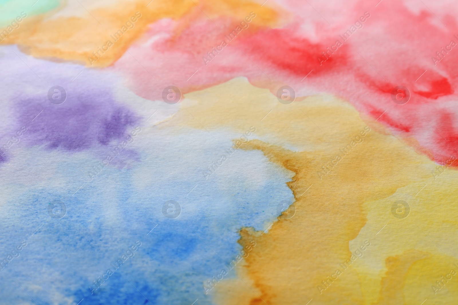 Photo of Abstract colorful background, closeup. Painted sheet of paper