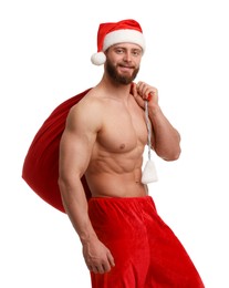 Muscular young man in Santa hat holding bag with presents on white background