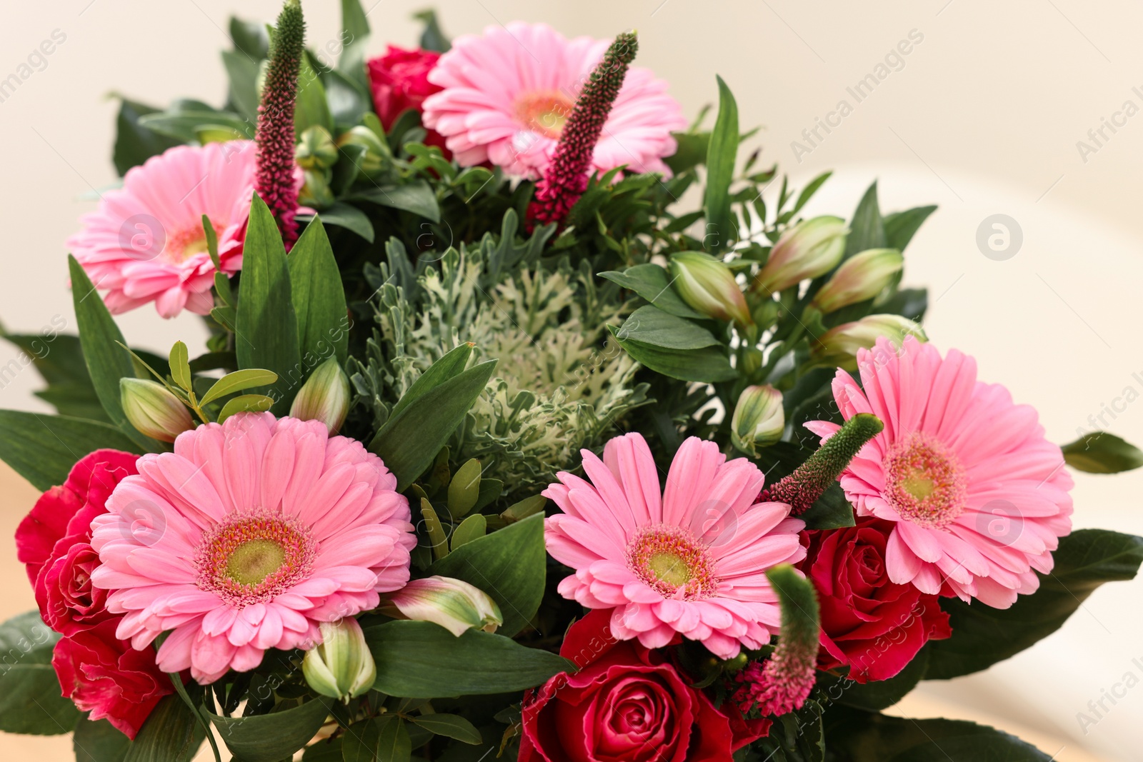 Photo of Bouquet of beautiful flowers on light background, closeup