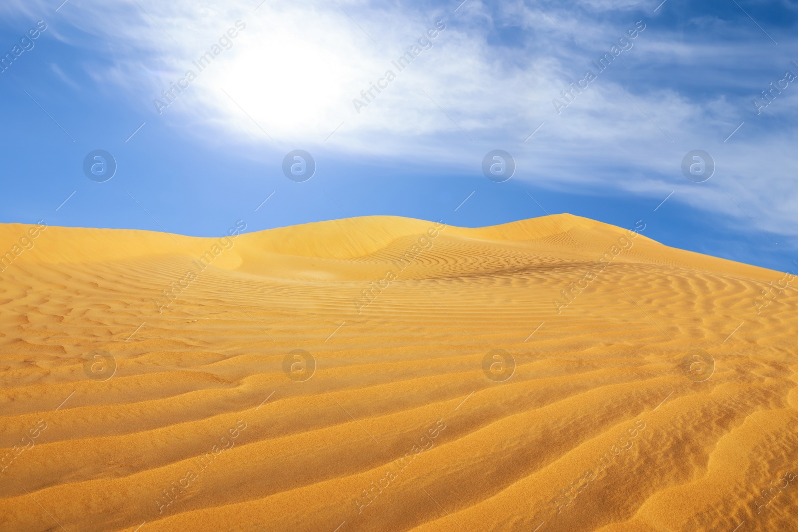 Image of Picturesque view of sandy desert and blue sky on hot sunny day 