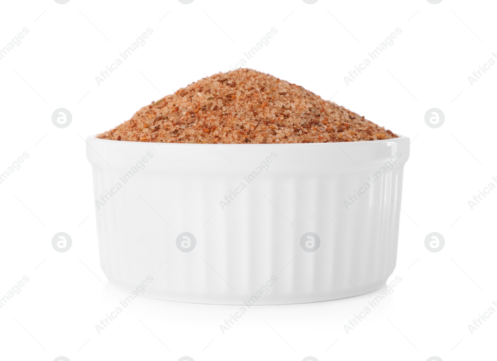 Photo of Pink salt with spices in bowl isolated on white