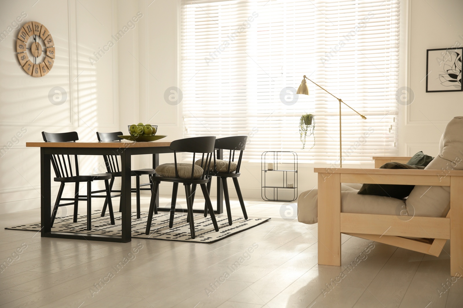 Photo of Stylish wooden dining table and chairs in room. Interior design