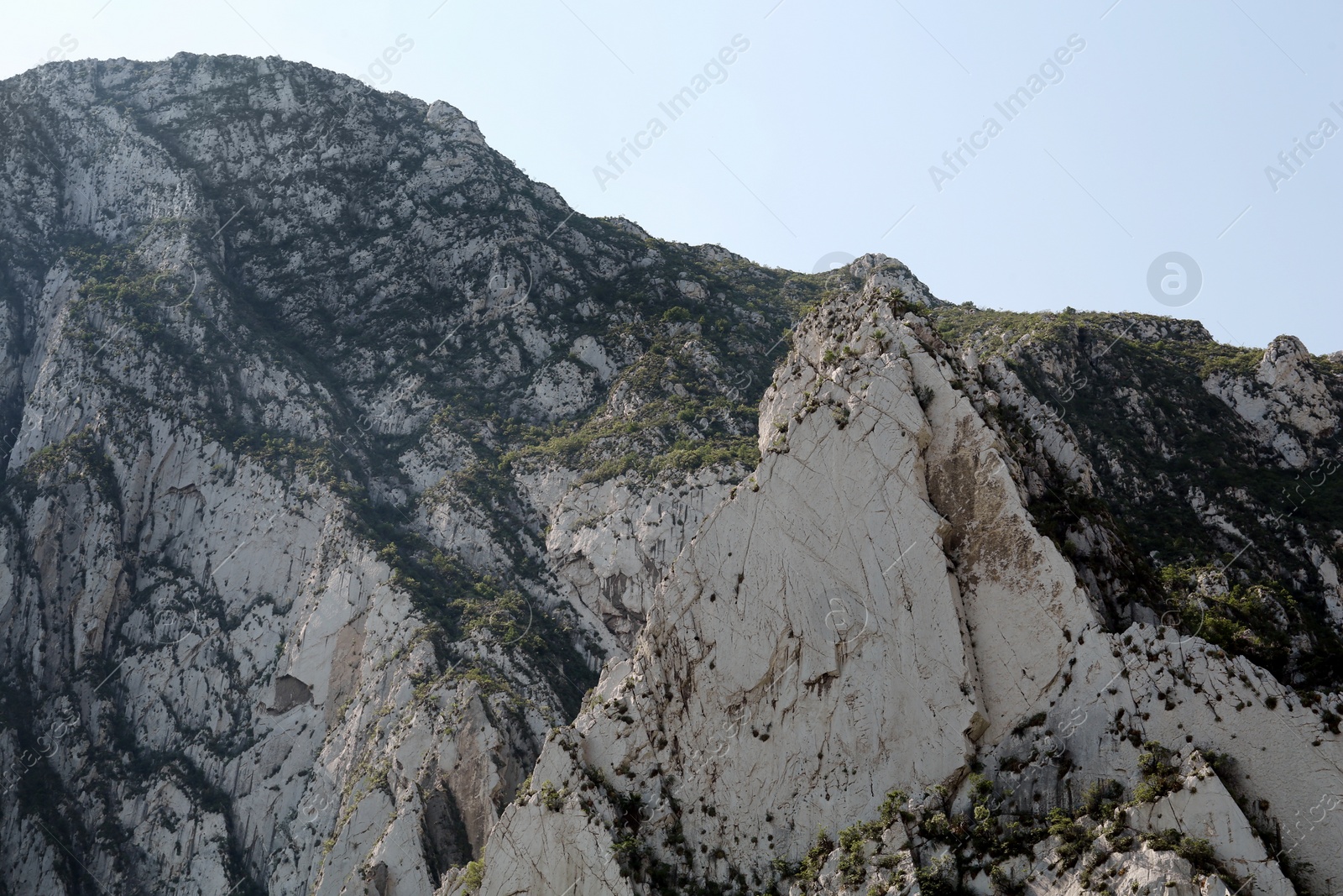 Photo of Picturesque view of beautiful mountains under bright sky