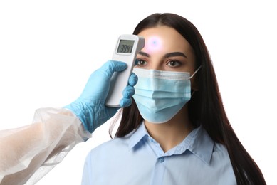 Doctor measuring woman's temperature on white background, closeup. Prevent spreading of Covid-19