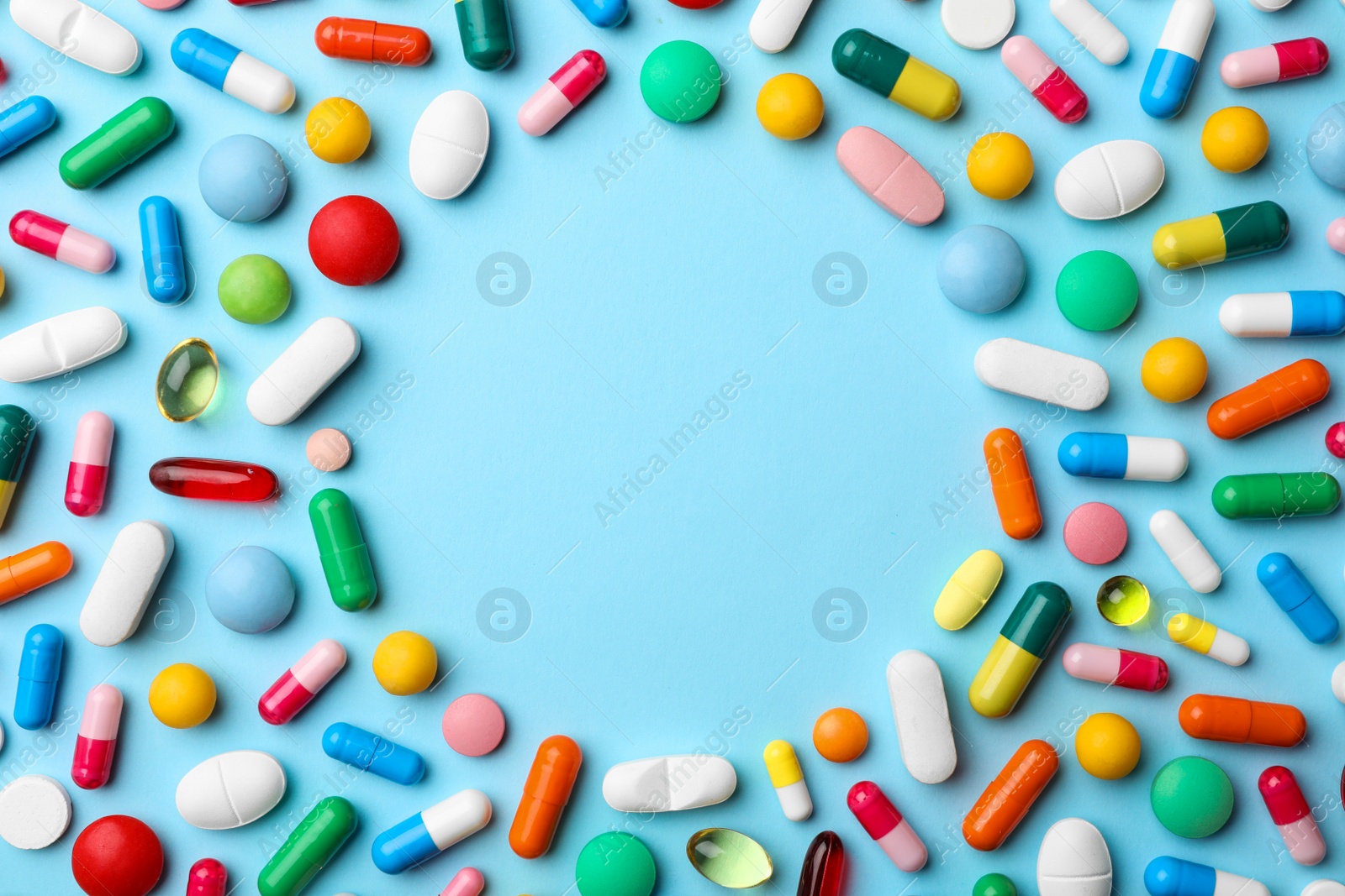 Photo of Frame made of pills on color background, flat lay with space for text
