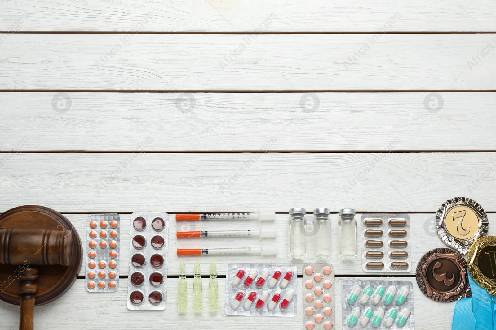 Photo of Flat lay composition with drugs on white wooden table, space for text. Doping control