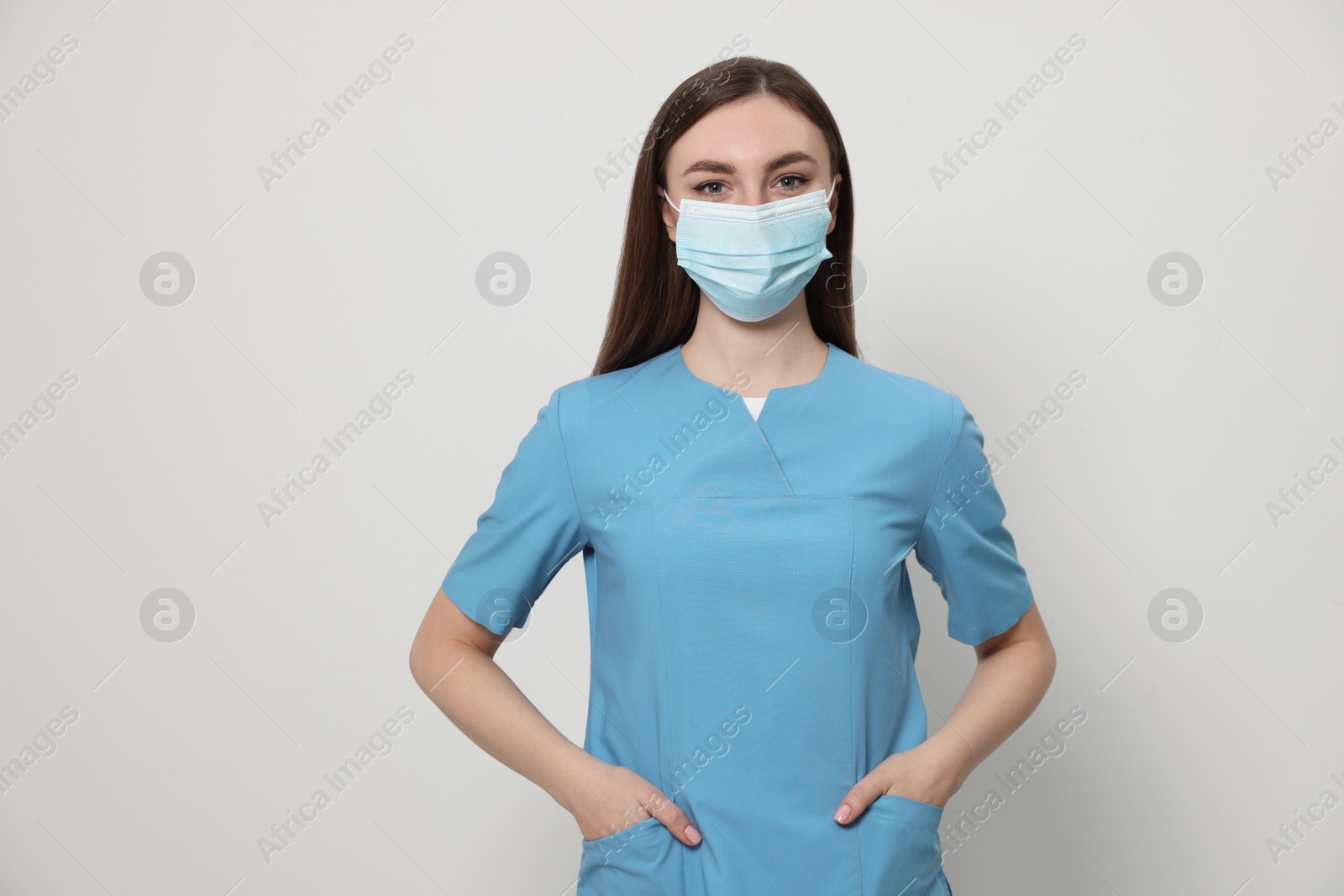 Photo of Nurse with medical mask on white background
