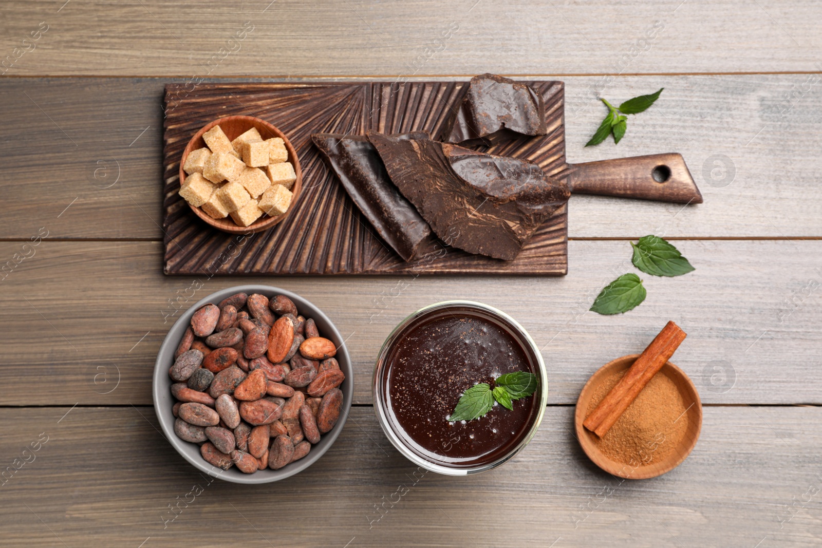 Photo of Flat lay composition with glass of hot chocolate on wooden table