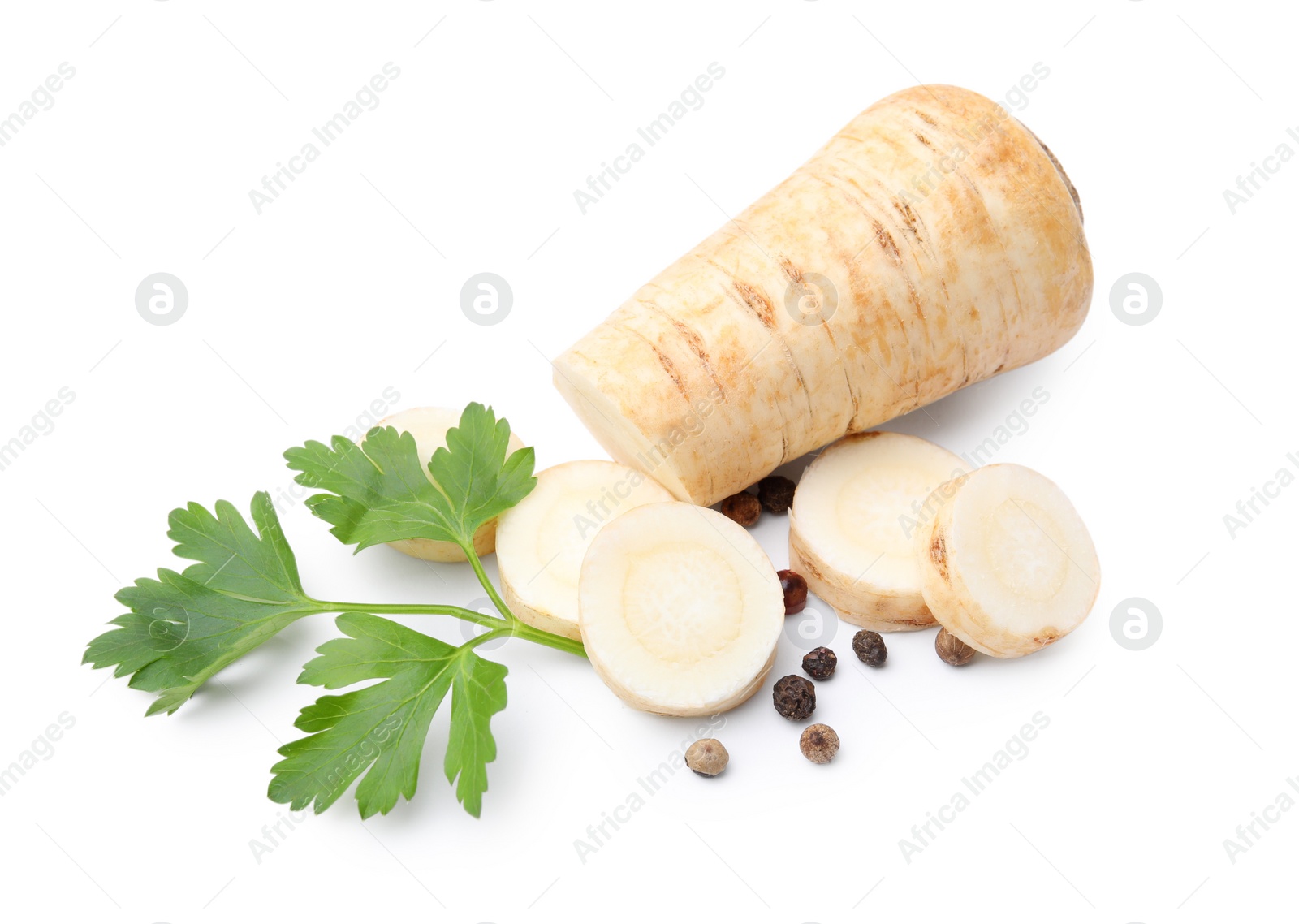 Photo of Whole and cut raw parsley root, fresh herb isolated on white