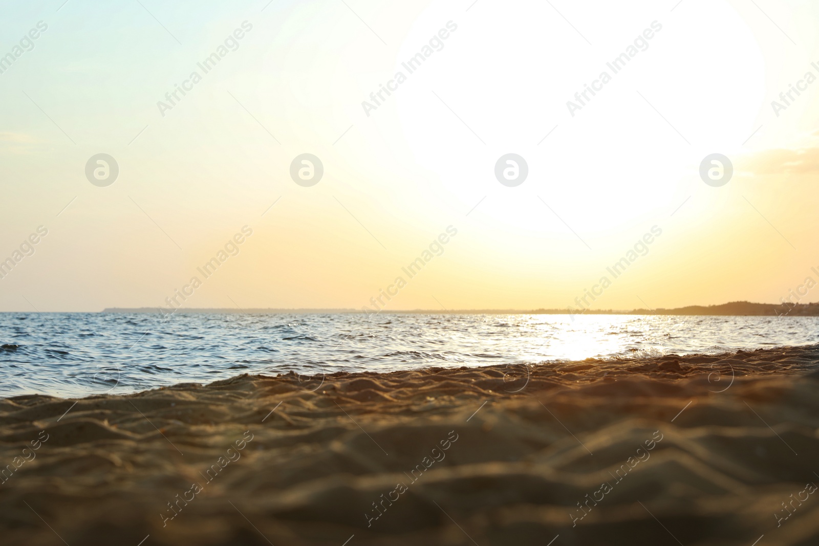 Photo of Beautiful view of sandy beach on sunset