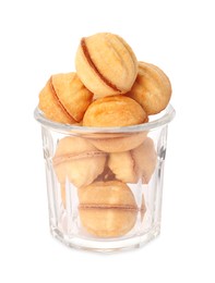 Photo of Jar of delicious nut shaped cookies with condensed milk on white background