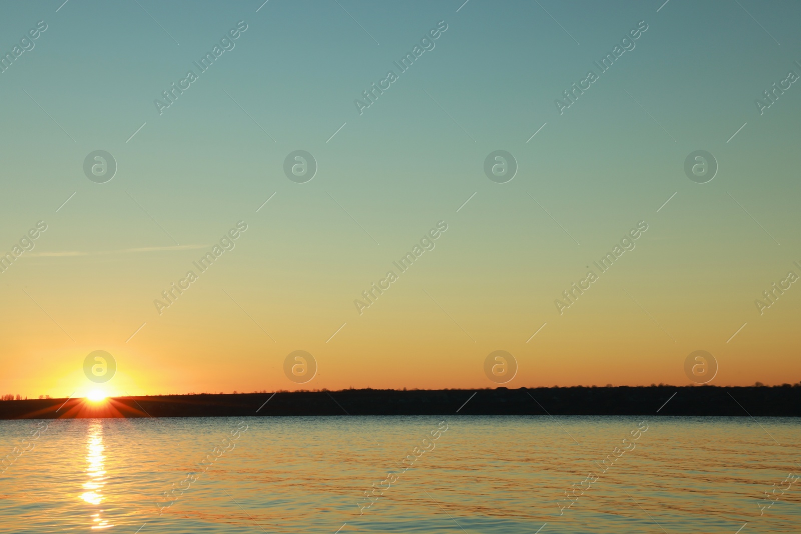 Photo of Picturesque view of beautiful sunset over calm river