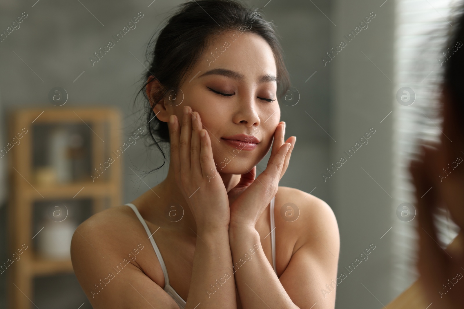Photo of Portrait of beautiful woman indoors, view through mirror
