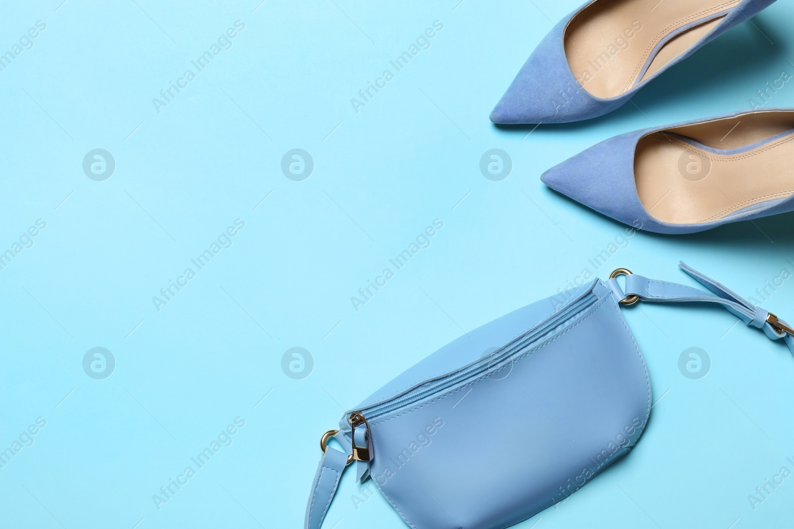 Photo of Flat lay composition with lady's shoes and bag on color background, space for text