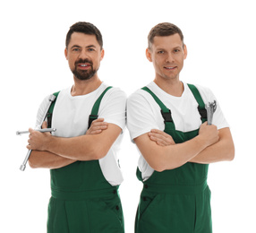 Photo of Portrait of professional auto mechanics on white background