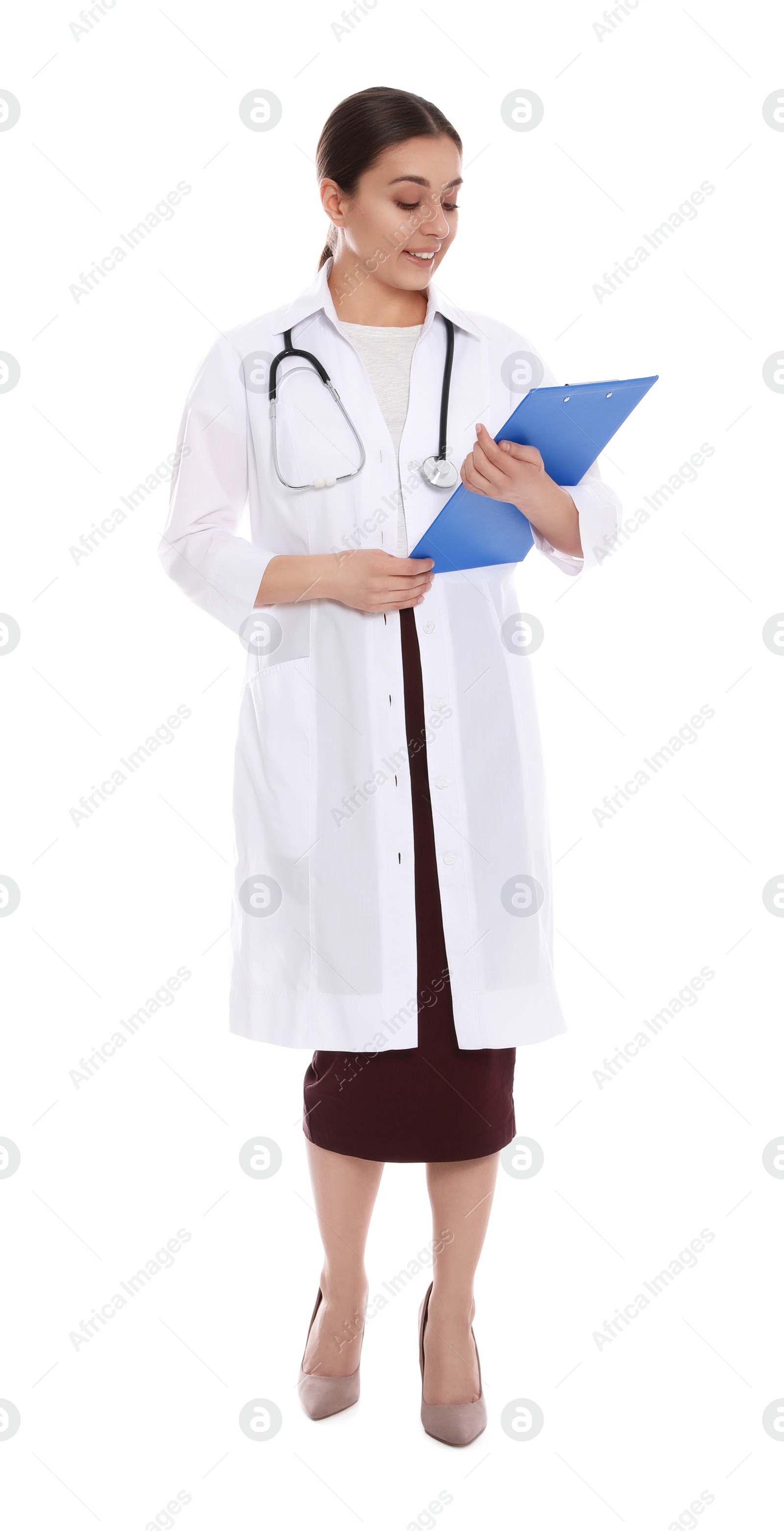 Photo of Full length portrait of medical doctor with clipboard and stethoscope isolated on white