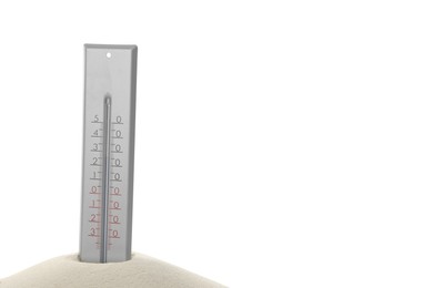 Photo of Weather thermometer in sand against white background