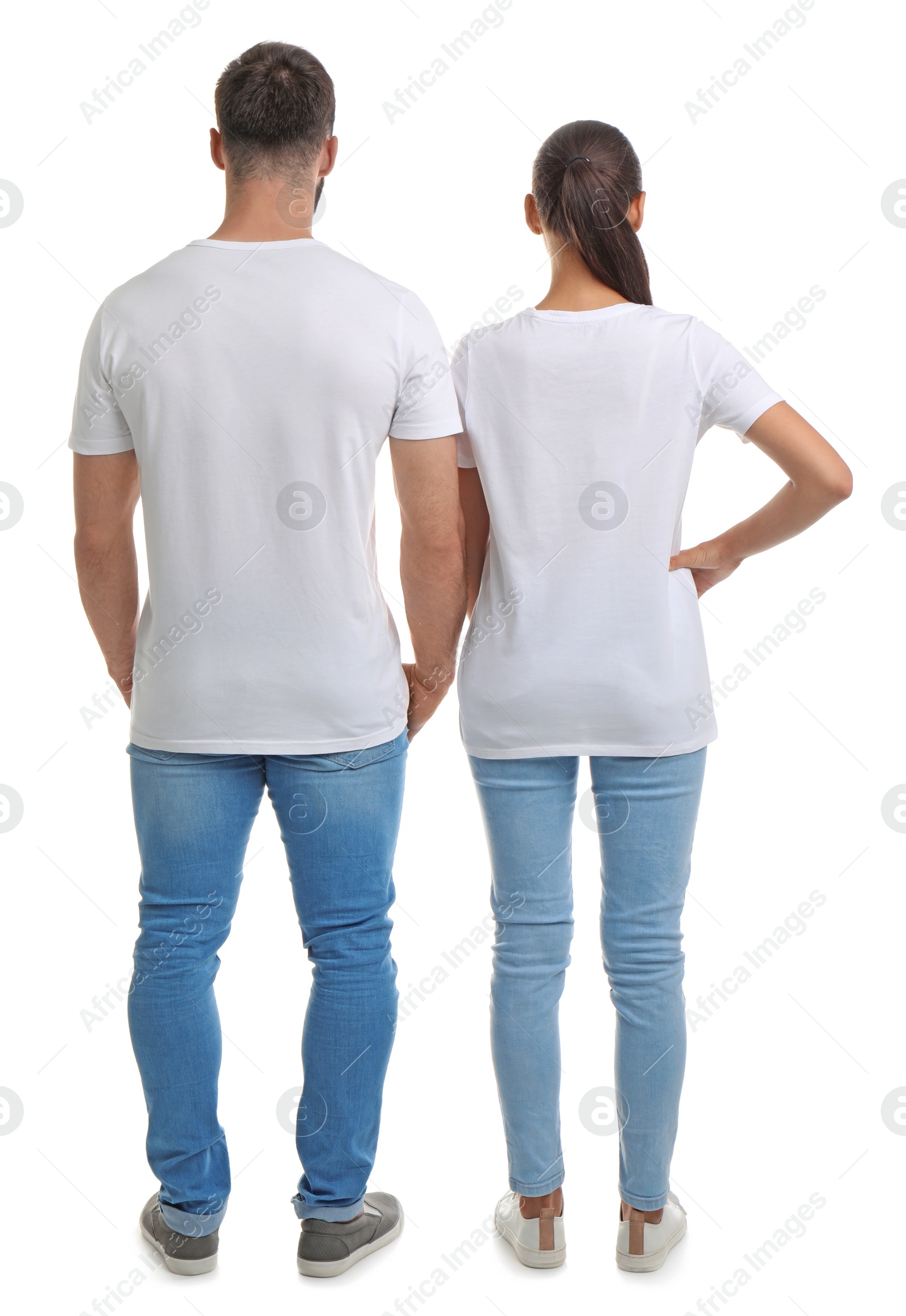 Photo of Young couple in t-shirts on white background. Mockup for design