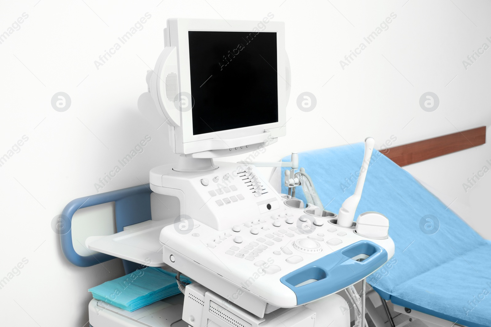 Photo of Ultrasound machine and examination table in hospital