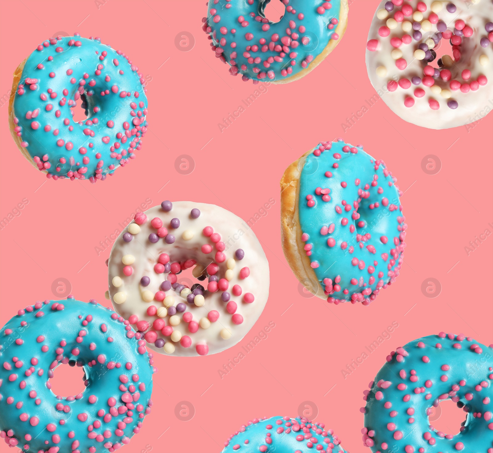 Image of Set of falling delicious donuts on pink background