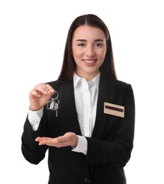 Photo of Happy young receptionist in uniform holding key on white background