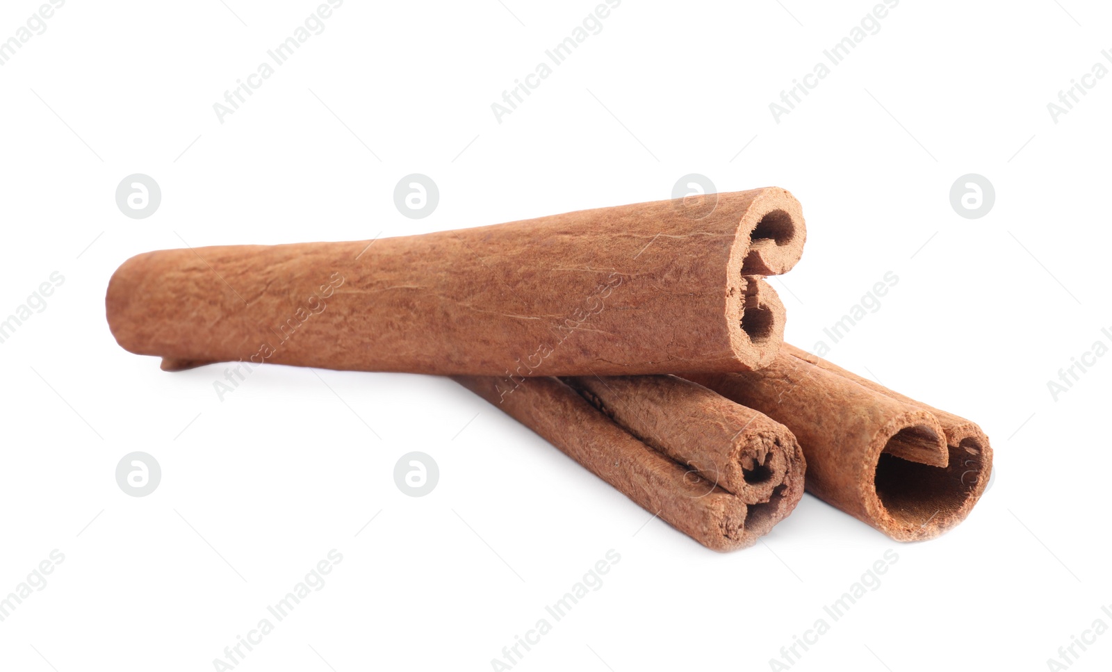 Photo of Three aromatic cinnamon sticks isolated on white